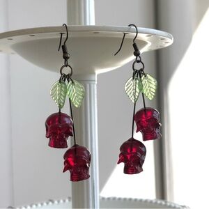 Skull Cherry Drop Earrings with Green Leaf Accents